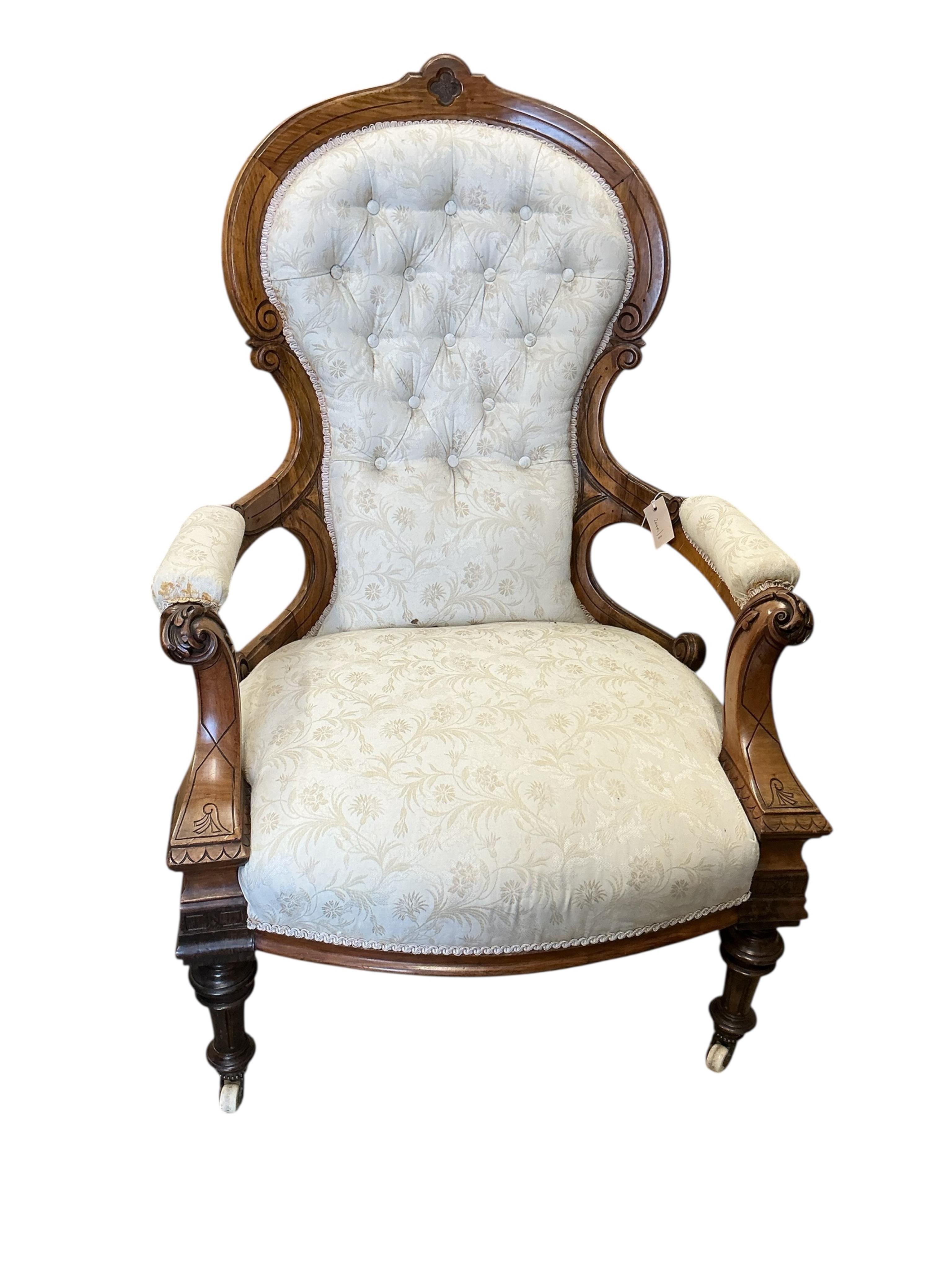 A Victorian upholstered walnut spoonback open armchair, width 70cm, depth 74cm, height 104cm